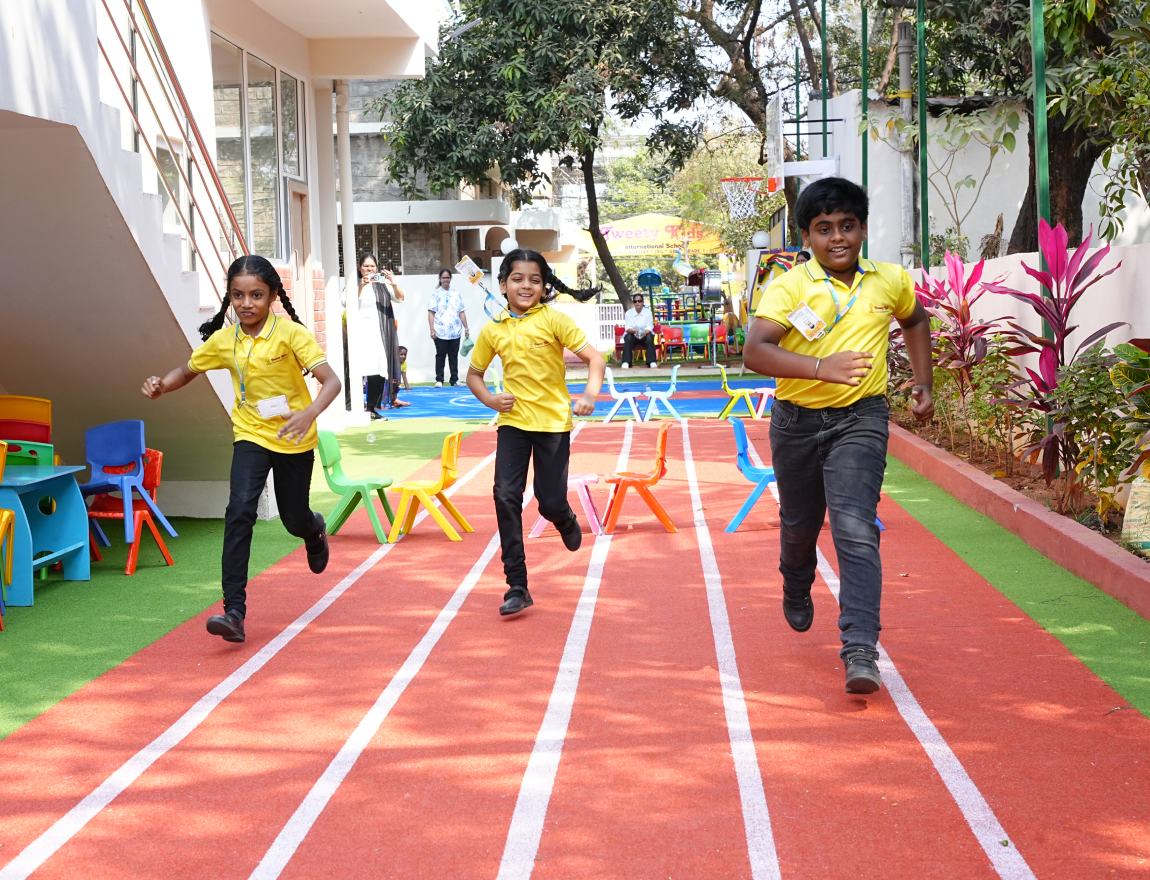 Students running on school sports track
